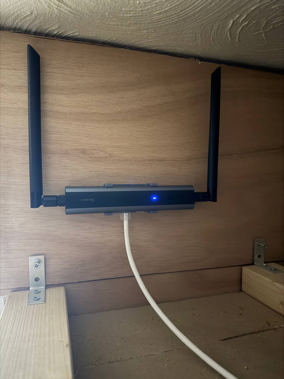 SONOFF Zigbee/Thread PoE Controller mounted on wall with PoE cable connected